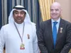 Mohammad al-Kamali alături de șeful FIFA Gianni Infantino