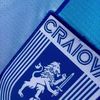 Universitatea Craiova va debuta în preliminariile Champions League cu un echipament nou, fără sponsorul principal pe tricouri. Foto: Facebook / Universitatea Craiova