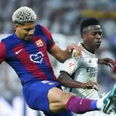 Rivalul, ajutor anti-depresie    Vinicius, starul revoltat al lui Real,  l-a susținut în clipele dificile pe Araujo, stoperul Barcelonei